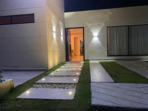 a house with a walkway with lights on it at Casa kalumaye ibague in Ibagué