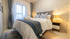 Postel nebo postele na pokoji v ubytování Chic Modern Midrand Escape + 44 fotografií