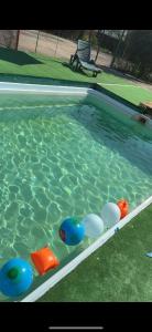 a swimming pool with toys in the water at Casa Bavareză in Caransebeş