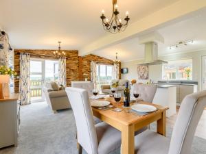 a dining room and living room with a table and chairs at 2 Bed in Kinlet 92657 in Kinlet