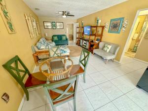 a living room with a table and a couch at Saltwater Retreat of Redington Shores in St Pete Beach
