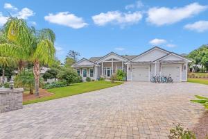 a large house with a driveway in front of it at SOUTHERN SEABREEZE 5BR POOL & BEACH by Barclé in Rosemary Beach +70 photos