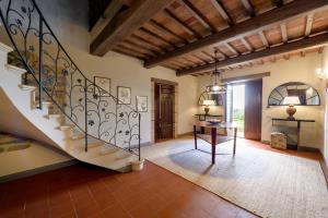 a hallway with a staircase in a house at Luxury Estate Villa Trasimena Lake in Magione