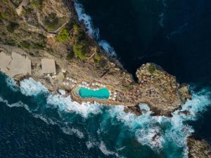 an aerial view of an island in the ocean at UNA HOTELS Capotaormina in Taormina
