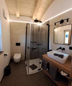 a bathroom with a shower and a sink and a toilet at Chalet Groissenbach in Reit im Winkl