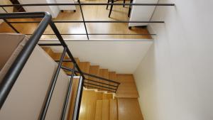 a staircase with metal railings in a building at Santa Chiara Boutique Hotel in Naples