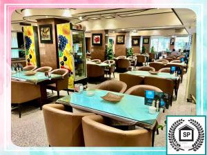 a dining room with tables and chairs in a restaurant at Al-Sadier Place Hotel & Restaurant in Baghdad +30 photos