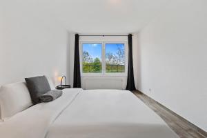 Tempat tidur dalam kamar di Tranquil Haven - Relax and Unwind in Hamm ID23