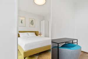 Postel nebo postele na pokoji v ubytování Stylish and Luxurious Apt with Pool & Gym + 35 fotografií