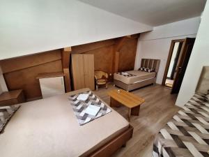 Postelja oz. postelje v sobi nastanitve Hostel Izvor
