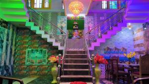 a staircase in a room with colorful stairs at Dream Live Stay Inn in Srinagar