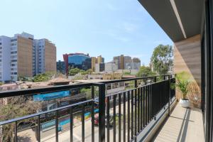 a balcony with a view of the city at Amazing 1BR with modern balcony in San Isidro in Lima