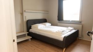 Postel nebo postele na pokoji v ubytování Hotel Smedegaarden