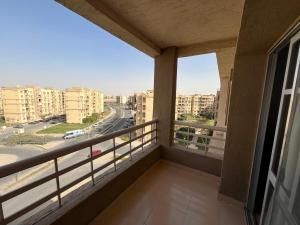 a balcony with a view of a city street at Madinaty Royal Elite Residence in Madinaty