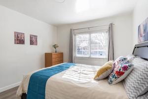 a bedroom with a large bed and a window at Newly Renovated 2BR 1BA Near San Jose Downtown up to 20 percent off in San Jose
