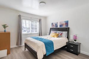 a bedroom with a bed and a window at Newly Renovated 2BR 1BA Near San Jose Downtown up to 20 percent off in San Jose