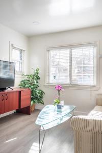 a living room with a couch and a glass table at Newly Renovated 2BR 1BA Near San Jose Downtown up to 20 percent off in San Jose