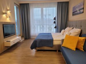 Posteľ alebo postele v izbe v ubytovaní Bel Mare Wyspa, apartament z parkingiem gratis + 37 fotografií