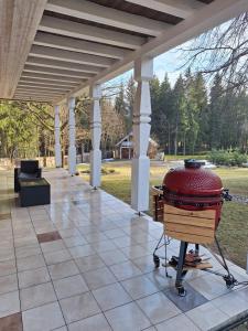 a bbq grill sitting on a patio at Stay Lagom in Plateliai