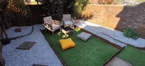 an aerial view of a patio with chairs and grass at Mulberry House Excellent central location Courtyard garden 3 Bedrooms sleeps up to 6 Parking in Exeter