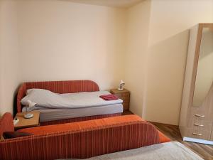 Posteľ alebo postele v izbe v ubytovaní START Apartmanok