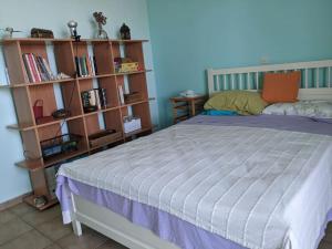 Postel nebo postele na pokoji v ubytování Attic Meltemi