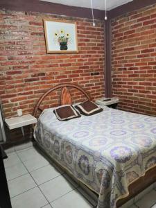 Postel nebo postele na pokoji v ubytování Hotel Villas Kerendarhú + 3 fotografie