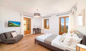 Postel nebo postele na pokoji v ubytování Sun Stone Villas