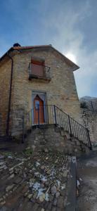 a brick building with a door and a balcony at Casa Castillón in Ceresa +7 photos