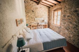 Postel nebo postele na pokoji v ubytování Agriturismo Le Valli + 37 fotografií