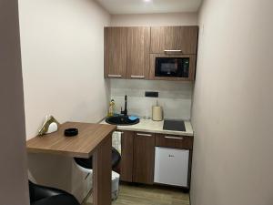 Kuchyň nebo kuchyňský kout v ubytování Apartmani Aso-Ler