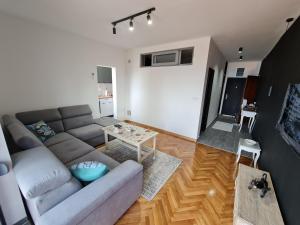 a living room with a couch and a table at Apartment Ralf in Ulcinj