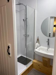a bathroom with a shower and a sink at Woolaway 2 in Taunton