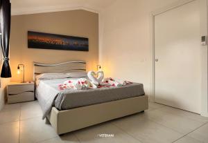 En eller flere senge i et værelse på Veterani Holidays Cefalù