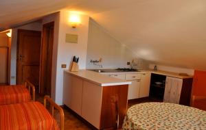 a kitchen with a sink and a counter top at Appartamenti Pian d'Alma in Punta Ala