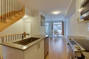 a kitchen with a sink and a counter top at Brand new townhouse, 30 minutes to Downtown in Toronto