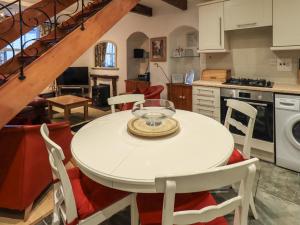 a kitchen with a table with a bowl on it at Partridge Holme in Bowness-on-Windermere