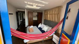 a bed in a hammock in a room at La Marteja in Salento