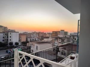 a view of a city at sunset from a balcony at S'Agapò in Torre del Greco