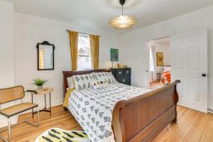 a bedroom with a bed and a chair at Danville Rental, Walk to Caesars Virginia Casino in Danville