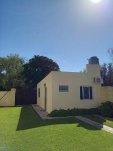 a house with a tower on top of a yard at el sueño del pibe in San Antonio de Areco