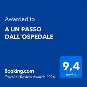 a blue rectangle with the words awarded to aun paso dall oasis at A UN PASSO DALL'OSPEDALE in Padova