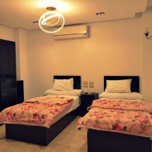 Ένα ή περισσότερα κρεβάτια σε δωμάτιο στο Summer Land Hotel