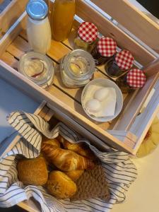 a drawer filled with bread and other food items at Sunnemoslantliv B&B in Sunnemo