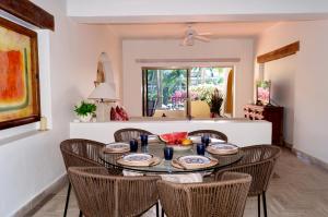 a dining room with a table and chairs at Velas Vallarta Ocean View in Puerto Vallarta