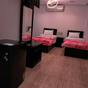 Ένα ή περισσότερα κρεβάτια σε δωμάτιο στο Summer Land Hotel