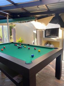 a pool table with balls on top of it at Doordrift Extension in Cape Town