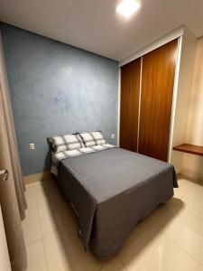 Giường trong phòng chung tại Casa Impecável