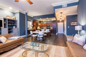 a living room with a couch and a table at Downtown Sophistication/ Two Bedroom / Two Bath in Louisville