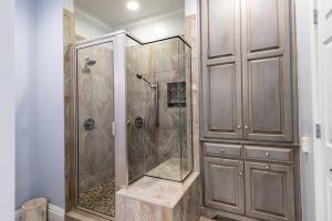 a shower with a glass door in a bathroom at Downtown Sophistication/ Two Bedroom / Two Bath in Louisville